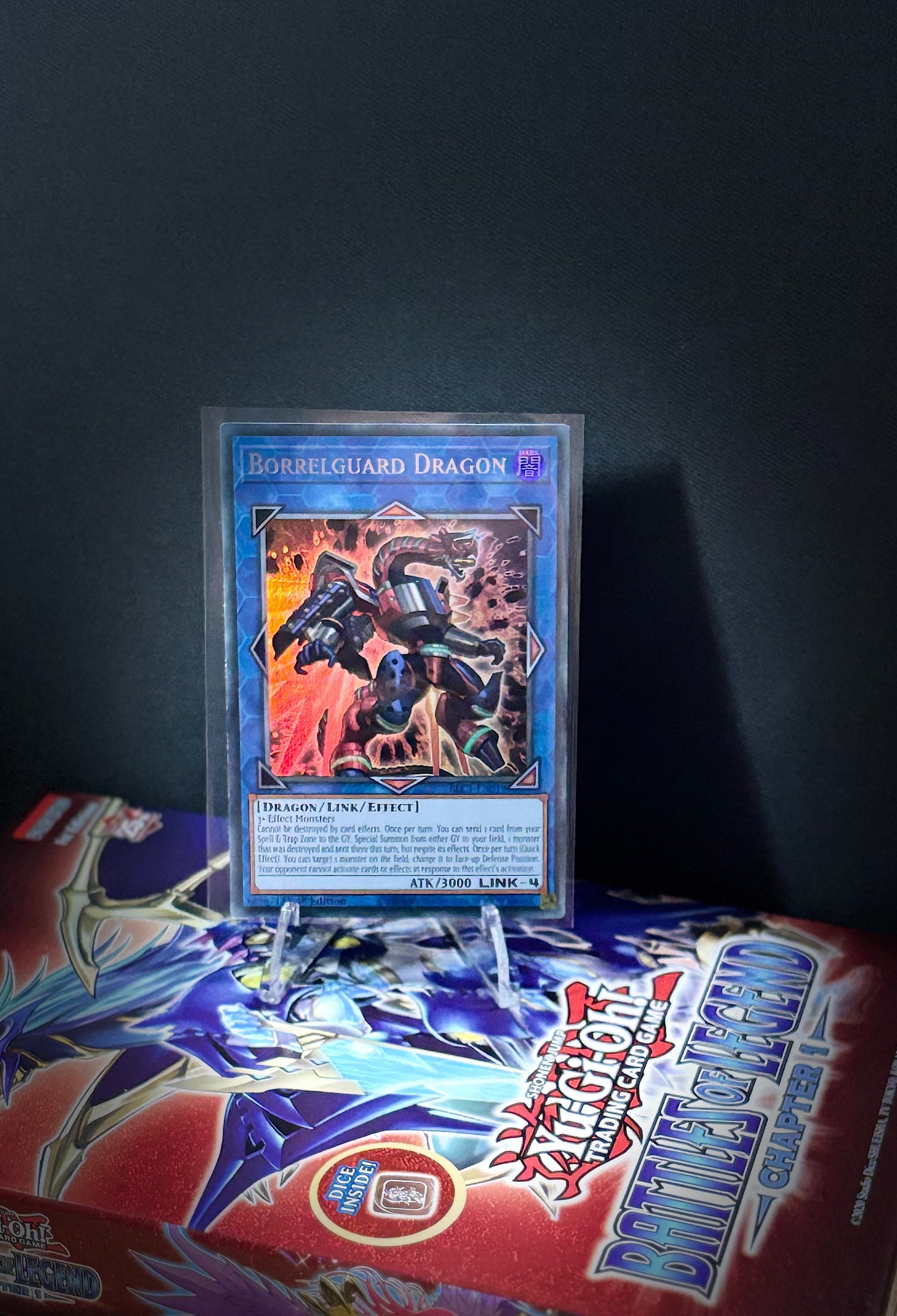 Trading card featuring a dragon in a protective stance on a dark background