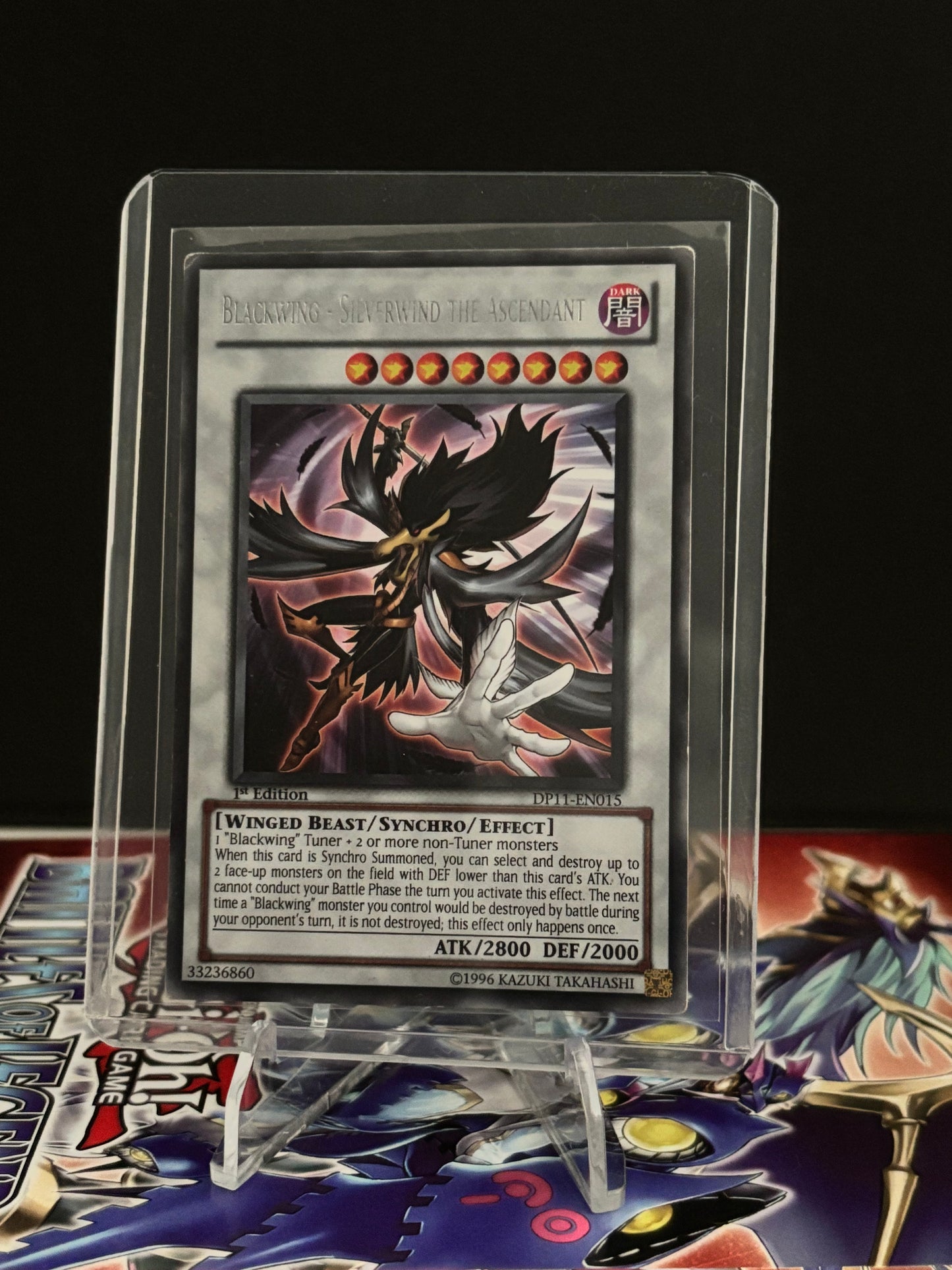 Trading card with artwork and text on a black background